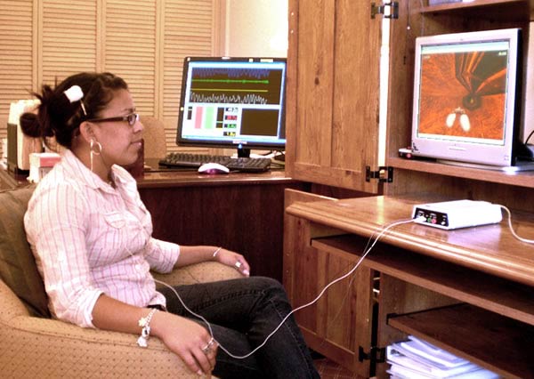 This young woman is controlling a spaceship as she trains her brain to become more attentive